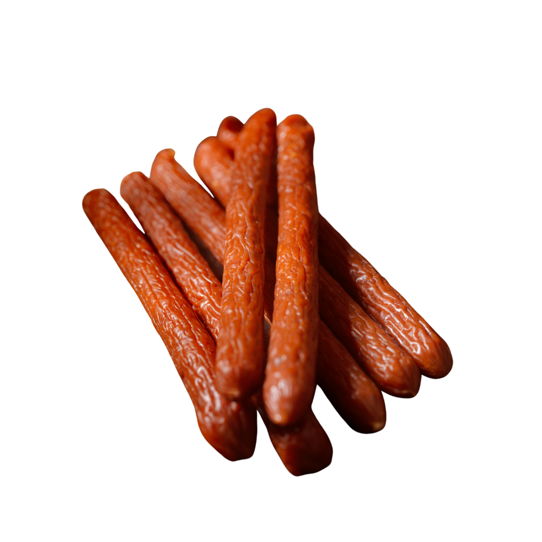 Beef pepperoni sticks on a white background