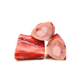 Three raw meat bones on a white background
