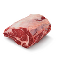 Raw beef prime rib roast on a white background