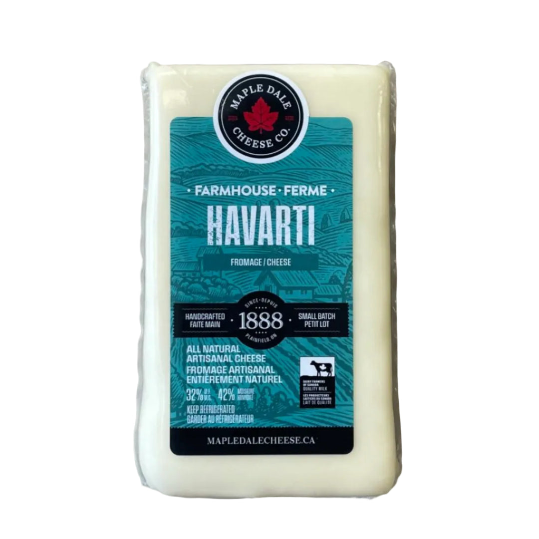Block of Havarti cheese with a Maple Dale Cheese Co. label on a wooden surface
