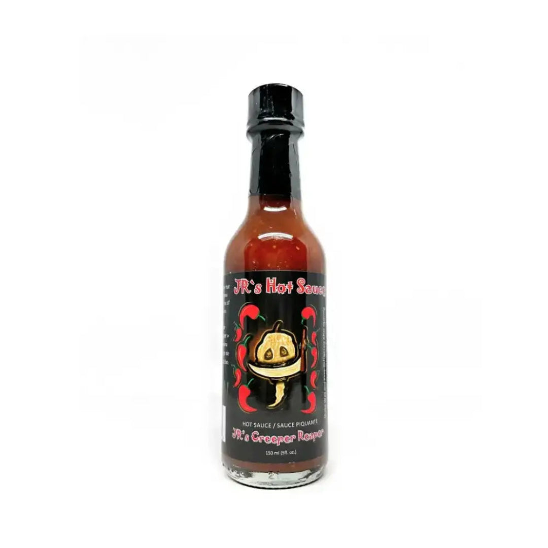 Hot sauce bottle with a black label featuring a cartoon character on a white background