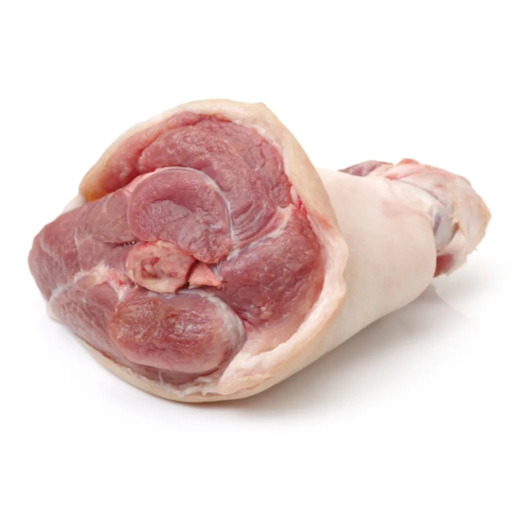 Raw pork hocks on a white background