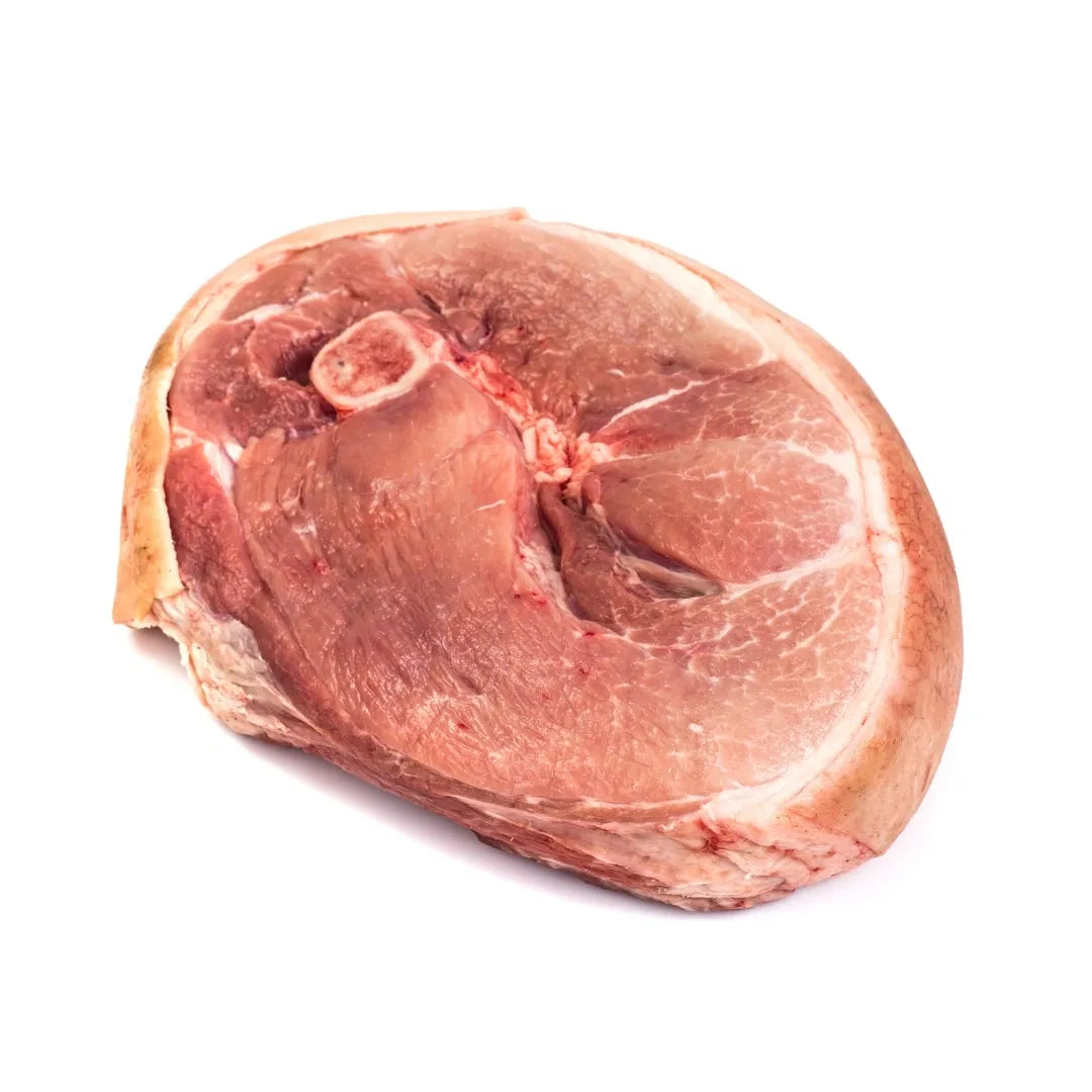 Raw ham steak on a white background
