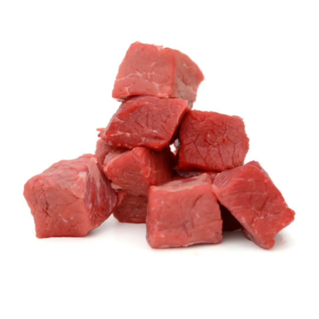 Raw bison cubes on a white background