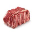 raw bison cross rib roast on a white background