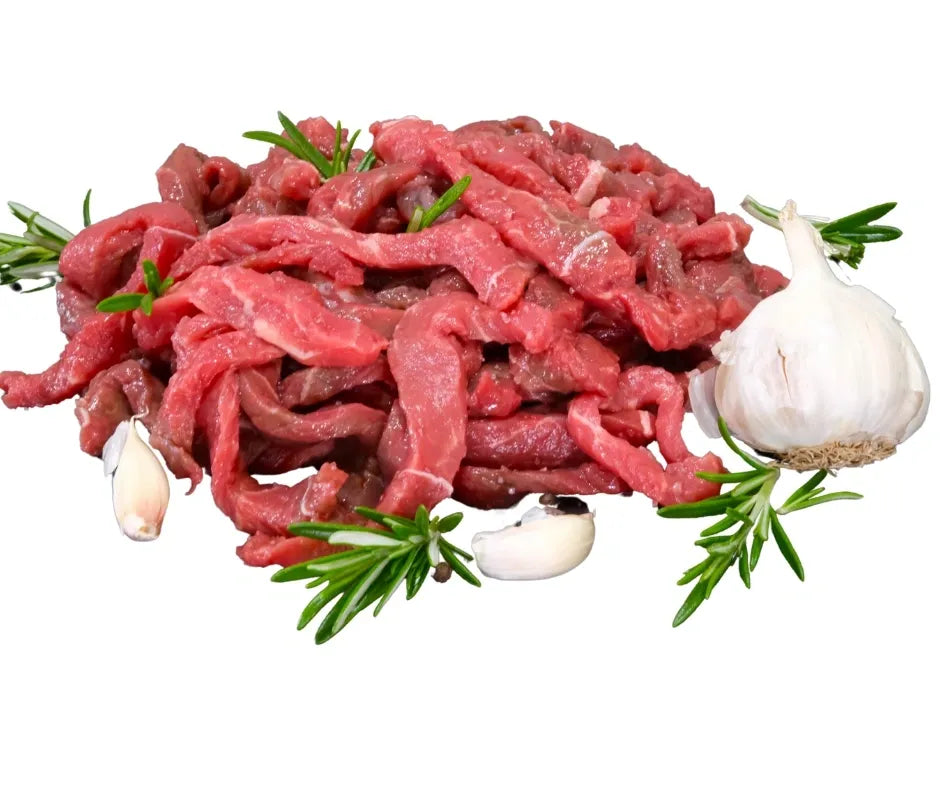 raw bison stir-fry strips on a white background