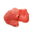 Bison minute steak on a white background