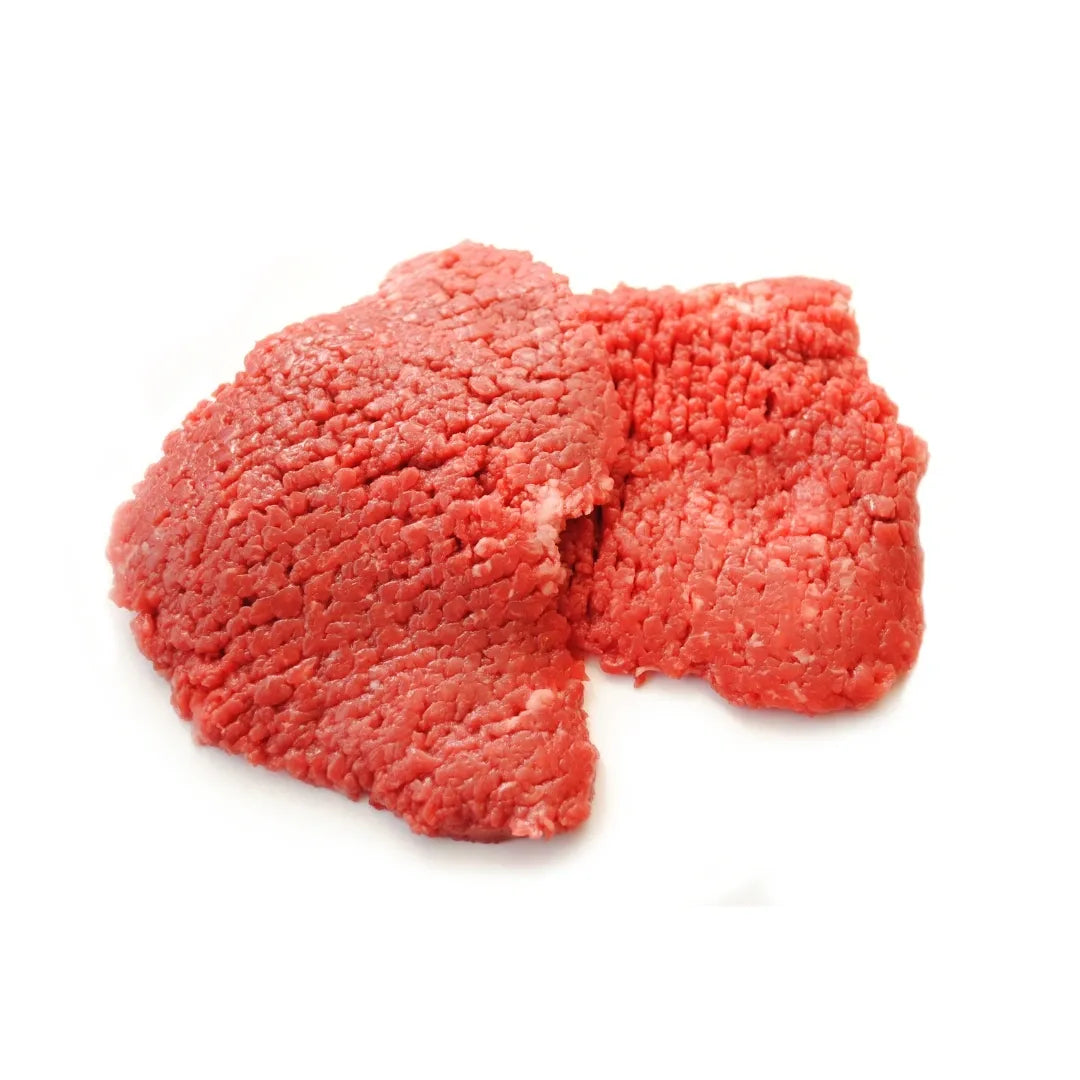 Bison minute steak on a white background